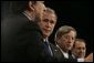 President George W. Bush stands with European Commission President Jose Manuel Barroso, left, European Union President Jean-Claude Juncker and European Union Council Secretariat Javier Solana, right, during a joint news conference Tuesday, Feb. 22, 2005, in Brussels. White House photo by Eric Draper