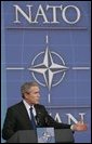 President George W. Bush speaks during a joint news conference with NATO Secretary General Jaap de Hoop Scheffer at NATO Headquarters in Brussels, Tuesday, Feb. 22, 2005. White House photo by Paul Morse