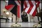 President George W. Bush and Prime Minister Tony Blair of the United Kingdom walk together after addressing the press at the Ambassador's Residence in Brussels, Belgium, Tuesday Feb. 22, 2005. 