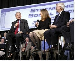 President George W. Bush shares a laugh with stage participants Frank Partin, right, and his daughter Amy during a Conversation on Strengthening Social Security at the Pease International Tradeport Airport, Wednesday, Feb. 16, 2005.  White House photo by Eric Draper