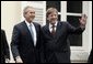 President George W. Bush and Belgian Prime Minister Guy Verhofstadt wave to the press outside the Prime Minister's office in Brussels, Belgium, Feb. 21, 2005. White House photo by Paul Morse