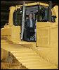 President George W. Bush inspects the driver’s compartment of a large Caterpillar bulldozer during a tour of the Caterpillar Inc. facility Tuesday, Jan. 30, 2007, in East Peoria, Ill., where President Bush addressed workers at the plant about the strength and growth of the U.S. economy. White House photo by Paul Morse