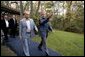 President George W. Bush escorts President Vladimir Putin of Russia after his arrival at Camp David, Friday, Sept. 26, 2003. White House photo by Eric Draper