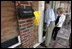 Vice President Dick Cheney and Mrs. Cheney survey damages in one Gulfport, Mississippi home Thursday, September 8, 2005, during a walking tour of a neighborhood that was damaged recently by Hurricane Katrina.