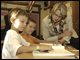 Secretary Spellings reads with students at Humboldt Park Charter School in Milwaukee, Wisconsin.  During the visit, Spellings presented an Early Reading First grant to Marquette University that will benefit students in the Milwaukee area.