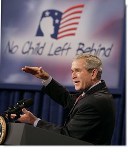 President George W. Bush gestures as he addresses his remarks Thursday, Oct. 5, 2006, at the Woodridge Elementary and Middle Campus in Washington, D.C., where President Bush praised the education advancements made through the No Child Left Behind law but also talked about ideas to strengthen the law in the future. White House photo by Paul Morse