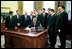 President Bush signs the 21st Century Nanotechnology Research and Development Act in the Oval Office Dec. 3, 2003. Nanotechnology offers the promise of breakthroughs that will revolutionize the way we detect and treat disease, monitor and protect the environment, produce and store energy, and build complex structures as small as an electronic circuit or as large as an airplane. 