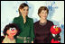 Mrs. Laura Bush stands with Her Majesty Queen Rania Al-Abdullah of Jordan and Sesame Street characters Khokha, left, and Elmo during a dinner celebrating the partnership between the Sesame Workshop and the Mosaic Foundation at the National Building Museum in Washington, D.C., Wednesday, May 9, 2006. Founded by the spouses of Arab Ambassadors to the United States, the Mosaic Foundation is dedicated to improving the lives of women and children. White House photo by Shealah Craighead 