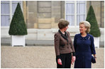 Mrs. Laura Bush visits with Madame Beradette Chirac outside the Elysee Palace during the International Centre for Missing and Exploited Children Meeting Wednesday, Jan. 17, 2007.