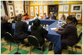 The President and Mrs. Bush sit among children of prisoners, their mentors and administrators Friday, April 1, 2005, during a roundtable discussion at Paul Public Charter School in Washington DC. The president met with the kids and others as part of his Helping America's Youth initiative.