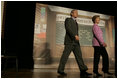 The President and Mrs. Bush arrive on stage at Paul Public Charter School in Washington DC Friday, April 1, 2005. The first lady introduced the president who spoke to the audience about his Helping America's Youth initiative.