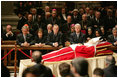 Pictured from left, President George W. Bush, Laura Bush, former President George H. W. Bush, former President Bill Clinton, Secretary of State Condoleezza Rice and White House Chief of Staff Andy Card pay their respects to Pope John Paul II as he lies in state in St. Peter's Basilica at the Vatican Wednesday, April 6, 2005.