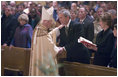 Cardinal Theodore McCarrick greets President George W. Bush and Mrs. Laura Bush after mass at the Cathedral of Saint Matthew the Apostle in Washington, DC on Saturday, April 2, 2005 in remembrance of Pope John Paul II.