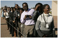 People wait in line to see the departure of Laura Bush Monday, July 11, 2005 at Gaborone International Airport in Gaborone, Botswana.