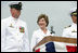 Mrs. Laura Bush smiles at Master Chief (SS) Mark K. Brooks, Command Master Chief, USS Texas, Saturday, September 9, 2006, after delivering remarks and giving the traditional command: "Man your ship and bring it to life!", during the Commissioning Ceremony in Galveston, Texas. Mrs. Bush participated in the christening of ship on July 31, 2004. White House photo by Shealah Craighead 