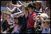 Mrs. Laura Bush sits with children of employees and staff at the U.S. Embassy Monday, in Sofia, Bulgaria, the last stop on a weeklong European visit by she and President George W. Bush.