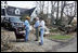 Vice President Dick Cheney and Mayor Greg Warr talk with one resident of a Gulfport, Mississippi neighborhood who's house was damaged recently by Hurricane Katrina Thursday, September 8, 2005.  Vice President and Mrs. Cheney took a walking tour of neighborhood and met with local residents of the area.