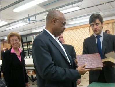 Secretary Paiges tours San Patrignano -- a drug rehabilation community that helps individuals return to society through educational and professional processes based on principles such as dignity, honesty, responsibility, respect for oneself and for others. Here, Secretary Paige admires the sharp craftsmanship of a leather book binder made inside the community by its members.