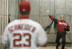 President George W. Bush warms up in preparation for his first pitch Thursday night, April 14, 2005, at RFK Stadium where the Washington Nationals made their inaugural home appearance.  Catching is Nationals' Brian Schneider.