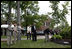 President George W. Bush and Australian Prime Minister John Howard participate in the presentation of White House trees at the Australian Ambassador's Residence, Sunday, May 14, 2006.