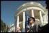 Members from the nation's armed services stand at attention with all the state flags along the drive leading up to the White House.