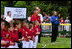 President George W. Bush and Mrs. Bush hosts Tee Ball on the South Lawn with The Fort Belvoir Little League Braves of Fort Belvoir, Virginia and the Naval Base Little League Yankees of Norfolk, Virginia, June 23, 2003.