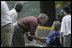 President George W. Bush hosts Tee Ball on the South Lawn with The Oriole Advocates Challengers of Marley Area Little League of Glen Burnie, Maryland and The Ridley Police Challengers of Leedom Little League, Ridley Park, Pennsylvania, July 27, 2003.