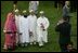 Invited guest attending the official arrival of India's Prime Minister Dr. Manmohan Singh, pose Monday, July 18, 2005, for a photo on the South Lawn of the White House. 