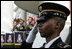 A member of the 3rd U.S. Infantry Old Guard Ceremonial Unit salutes Monday, July 18, 2005, at the arrival ceremony for India's Prime Minister Dr. Manmohan Singh, on the South Lawn of the White House. 