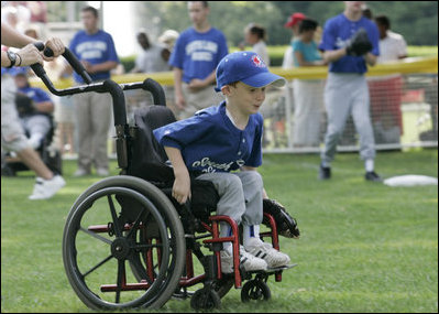 A young ballplayer from the District 12 Little League Challengers  of Williamsport, Pa., works the outfield Sunday, July 24, 2005, at a Tee Ball game on the South Lawn of the White House.