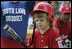 A player from the West University Little League Challengers from Houston, Texas, prepares to hit the ball, Sunday, July 24, 2005, during a Tee Ball game on the South Lawn of the White House.