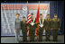 Laura Bush poses with the Young Marines Color Guard, Thursday, Oct. 27, 2005 at Howard University in Washington, during the White House Conference on Helping America's Youth. 