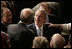 President George W. Bush greets people, shakes hands and signs his autograph after delivering the State of the Union Address in the House Chamber at the U.S. Capitol Tuesday, Jan. 23, 2007.