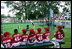 A Devil Dog cheers as a teammate rounds first base during the first game of the 2004 White House Tee Ball season June 13, 2004.