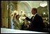 President George W. Bush and Laura Bush light a candle at St. John Episcopal Church in Washington, D.C., during a private service of prayer and remembrance Wednesday morning, September 11, 2002.