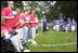 President George W. Bush hosts a White House Tee Ball (t-ball) game on the South Lawn between the Waynesboro, Virginia Little League Challenger Division Sand Gnats (Blue Team) vs. the East Brunswick, New Jersey Babe Ruth Buddy Ball League Sluggers (Red Team) September 22, 2002.