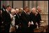 President George W. Bush bows his head during a prayer reading during the funeral service for former President Ronald Reagan at the National Cathedral in Washington, DC on June 11, 2004. 