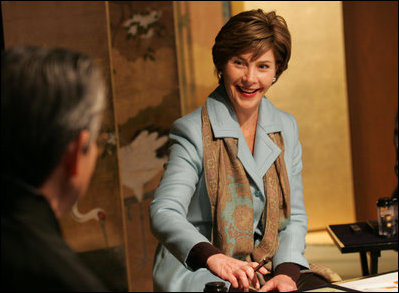 Mrs. Laura Bush smiles during an exchange Wednesday, Nov. 16, 2005, with Master Minoru Sawada, head calligraphy master of the Origin Arts Program, at the Suchiya-cho Townhouse in Kyoto, Japan.