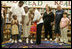 Laura Bush embraces a child Thursday, Sept. 8, 2005 of one of the families from New Orleans, displaced last week as a result of Hurricane Katrina,  during a meeting at the Greenbrook Elementary School in DeSoto County, Miss.  Greenbrook Elementary School has enrolled the most displaced students among the DeSoto County schools in Mississippi.