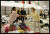 Laura Bush visits people affected by Hurricane Katrina at the Bethany World Prayer Center shelter, Monday, Sept. 5, 2005 in Baton Rouge, Louisiana, where hundreds of people have taken refuge.