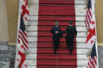 President George W. Bush and Georgian President Mikhail Saakashvili leave a press availability Tuesday, May 10, 2005, at the Georgian Parliament in Tbilisi.