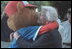 Barbara Bush, the President's mother, hugs the Little League mascot at game's end at the second Tee Ball game on the South Lawn on Sunday, June 3, 2001.