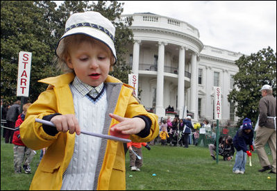 A little boy is careful not to drop his egg as he carries it through the Easter Egg Roll Monday, April 9, 2007, on the South Lawn during the 2007 White House Easter Egg Roll. White House photo by Joyce Boghosian