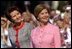 Mrs. Bush and Mrs. Kwasniewska stand together during the South Lawn ceremony at which the national anthems for both countries were performed and their husbands reviewed the troops. White House photo by Susan Sterner.