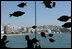 Summit-goers enjoy a beverage as they sit in the Chosun Westin Hotel in Busan, Korea Saturday, Nov. 19, 2005. In the background is Haeundae Beach and Suyeong Bay.