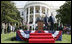 President Bush stands with India's Prime Minister Dr. Manmohan Singh, Monday, July 18, 2005 during the playing of the national anthems on the South Lawn of the White House. 