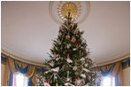 The official White House Christmas tree, an 18-foot Douglas fir tree donated by the Crystal Springs Tree Farm of Lehighton, Pa., stands in the Blue Room of the White House, Thursday, Nov. 30, 2006.