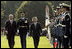 President George W. Bush and Prime Minister Junichiro Koizumi of Japan review the troops during an arrival ceremony on the South Lawn Thursday, June 29, 2006. "Japan is now the third largest donor nation for reconstruction efforts in Afghanistan," said President Bush in his address. "In Iraq, Japanese self-defense forces have helped improve the lives of citizens in a key Iraqi province that will soon return to Iraqi control."