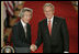 President George W. Bush shakes hands with Japan’s Prime Minister Junichiro Koizumi at the conclusion of their joint press availability Thursday, June 29, 2006, in the East Room of the White House.