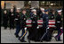 Vice President Dick Cheney and Mrs. Lynne Cheney salute as the casket of former President Gerald R. Ford is carried by a military honor guard during interment ceremonies on the grounds of the Gerald R. Ford Presidential Museum in Grand Rapids, Mich., Wednesday, January 3, 2007.